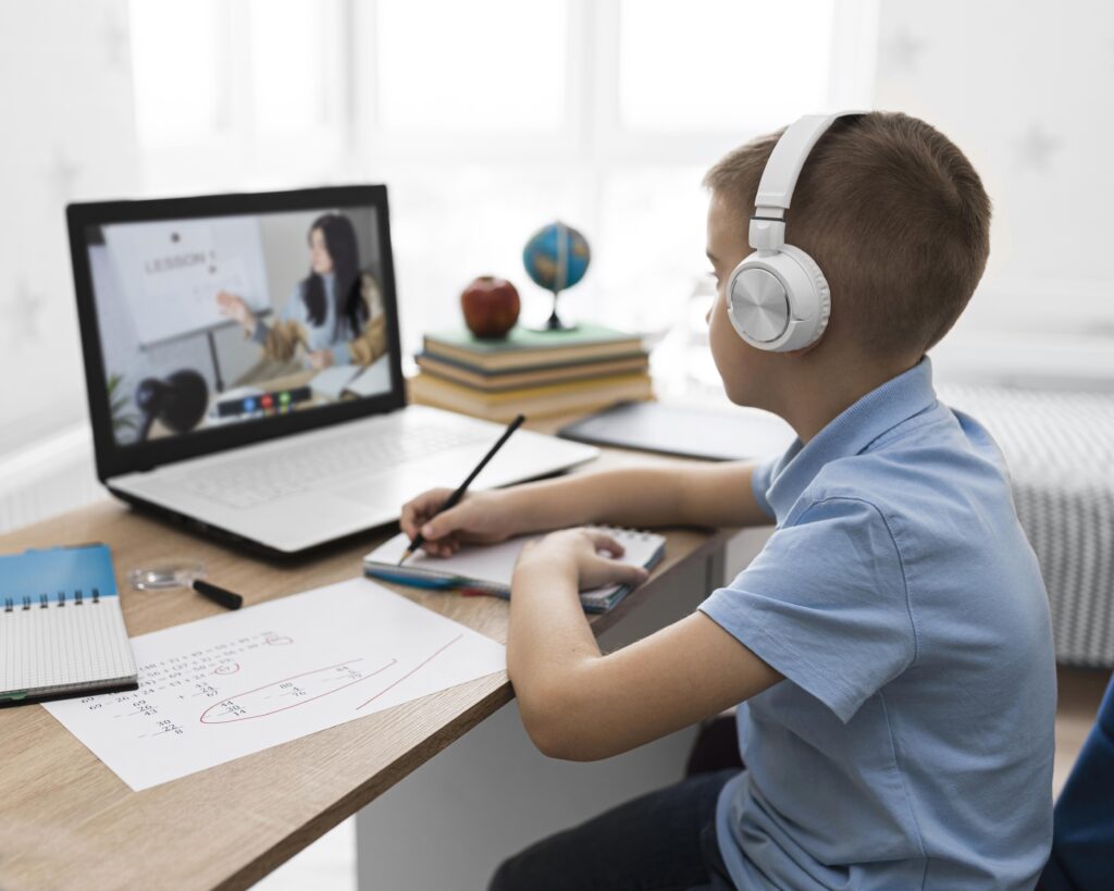 medium shot kid taking notes scaled